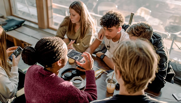 Group of teenagers drinking coffee