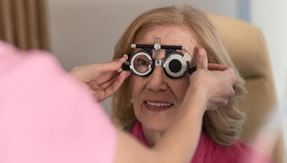 Woman getting an eye test as part of a health check